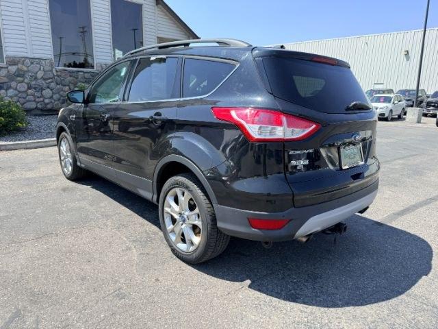 2014 BLACK /CLOTH Ford Escape (1FMCU9GX2EU) with an 16L I4 engine, Automatic transmission, located at 1175 N Woodruff Ave, Idaho Falls, ID, 83401, 43.506901, -111.999657 - Compact SUV practicality and everyday drivability come together in this 2014 Ford Escape 4WD equipped with a 1.6L EcoBoost turbocharged engine. Four wheel drive capability adds traction for changing road conditions while the compact SUV size keeps it easy to maneuver around town and in tighter parki- Photo#30