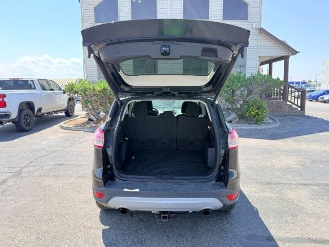2014 BLACK /CLOTH Ford Escape (1FMCU9GX2EU) with an 16L I4 engine, Automatic transmission, located at 1175 N Woodruff Ave, Idaho Falls, ID, 83401, 43.506901, -111.999657 - Compact SUV practicality and everyday drivability come together in this 2014 Ford Escape 4WD equipped with a 1.6L EcoBoost turbocharged engine. Four wheel drive capability adds traction for changing road conditions while the compact SUV size keeps it easy to maneuver around town and in tighter parki- Photo#33