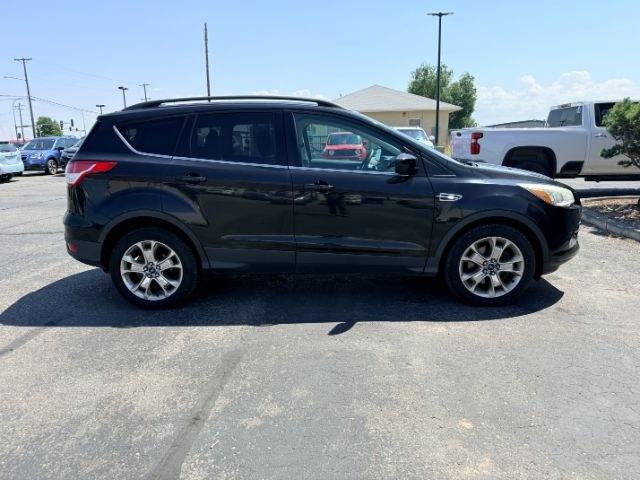 2014 BLACK /CLOTH Ford Escape (1FMCU9GX2EU) with an 16L I4 engine, Automatic transmission, located at 1175 N Woodruff Ave, Idaho Falls, ID, 83401, 43.506901, -111.999657 - Compact SUV practicality and everyday drivability come together in this 2014 Ford Escape 4WD equipped with a 1.6L EcoBoost turbocharged engine. Four wheel drive capability adds traction for changing road conditions while the compact SUV size keeps it easy to maneuver around town and in tighter parki- Photo#36