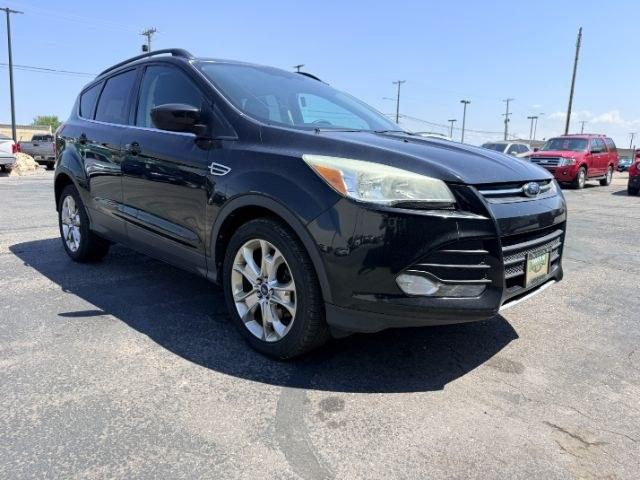 2014 BLACK /CLOTH Ford Escape (1FMCU9GX2EU) with an 16L I4 engine, Automatic transmission, located at 1175 N Woodruff Ave, Idaho Falls, ID, 83401, 43.506901, -111.999657 - Compact SUV practicality and everyday drivability come together in this 2014 Ford Escape 4WD equipped with a 1.6L EcoBoost turbocharged engine. Four wheel drive capability adds traction for changing road conditions while the compact SUV size keeps it easy to maneuver around town and in tighter parki- Photo#37