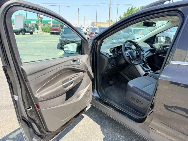 2014 BLACK /CLOTH Ford Escape (1FMCU9GX2EU) with an 16L I4 engine, Automatic transmission, located at 1175 N Woodruff Ave, Idaho Falls, ID, 83401, 43.506901, -111.999657 - Compact SUV practicality and everyday drivability come together in this 2014 Ford Escape 4WD equipped with a 1.6L EcoBoost turbocharged engine. Four wheel drive capability adds traction for changing road conditions while the compact SUV size keeps it easy to maneuver around town and in tighter parki- Photo#41
