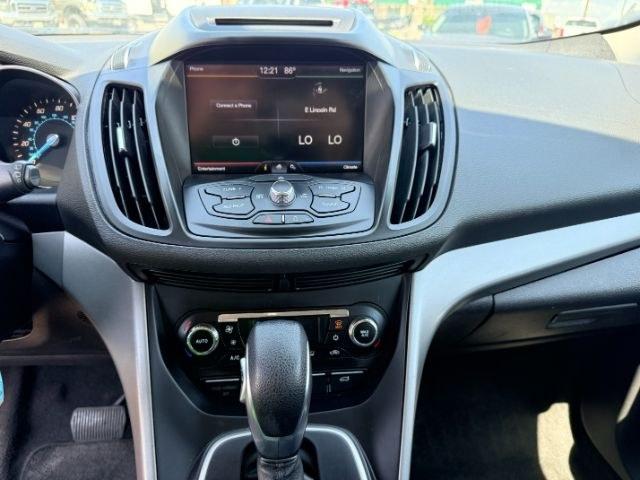 2014 BLACK /CLOTH Ford Escape (1FMCU9GX2EU) with an 16L I4 engine, Automatic transmission, located at 1175 N Woodruff Ave, Idaho Falls, ID, 83401, 43.506901, -111.999657 - Compact SUV practicality and everyday drivability come together in this 2014 Ford Escape 4WD equipped with a 1.6L EcoBoost turbocharged engine. Four wheel drive capability adds traction for changing road conditions while the compact SUV size keeps it easy to maneuver around town and in tighter parki- Photo#45
