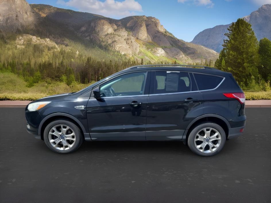 2014 BLACK /CLOTH Ford Escape (1FMCU9GX2EU) with an 16L I4 engine, Automatic transmission, located at 1175 N Woodruff Ave, Idaho Falls, ID, 83401, 43.506901, -111.999657 - Compact SUV practicality and everyday drivability come together in this 2014 Ford Escape 4WD equipped with a 1.6L EcoBoost turbocharged engine. Four wheel drive capability adds traction for changing road conditions while the compact SUV size keeps it easy to maneuver around town and in tighter parki- Photo#1