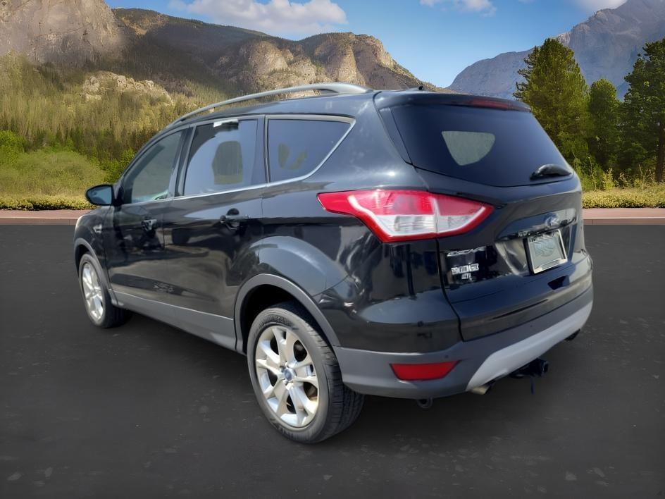 2014 BLACK /CLOTH Ford Escape (1FMCU9GX2EU) with an 16L I4 engine, Automatic transmission, located at 1175 N Woodruff Ave, Idaho Falls, ID, 83401, 43.506901, -111.999657 - Compact SUV practicality and everyday drivability come together in this 2014 Ford Escape 4WD equipped with a 1.6L EcoBoost turbocharged engine. Four wheel drive capability adds traction for changing road conditions while the compact SUV size keeps it easy to maneuver around town and in tighter parki- Photo#2