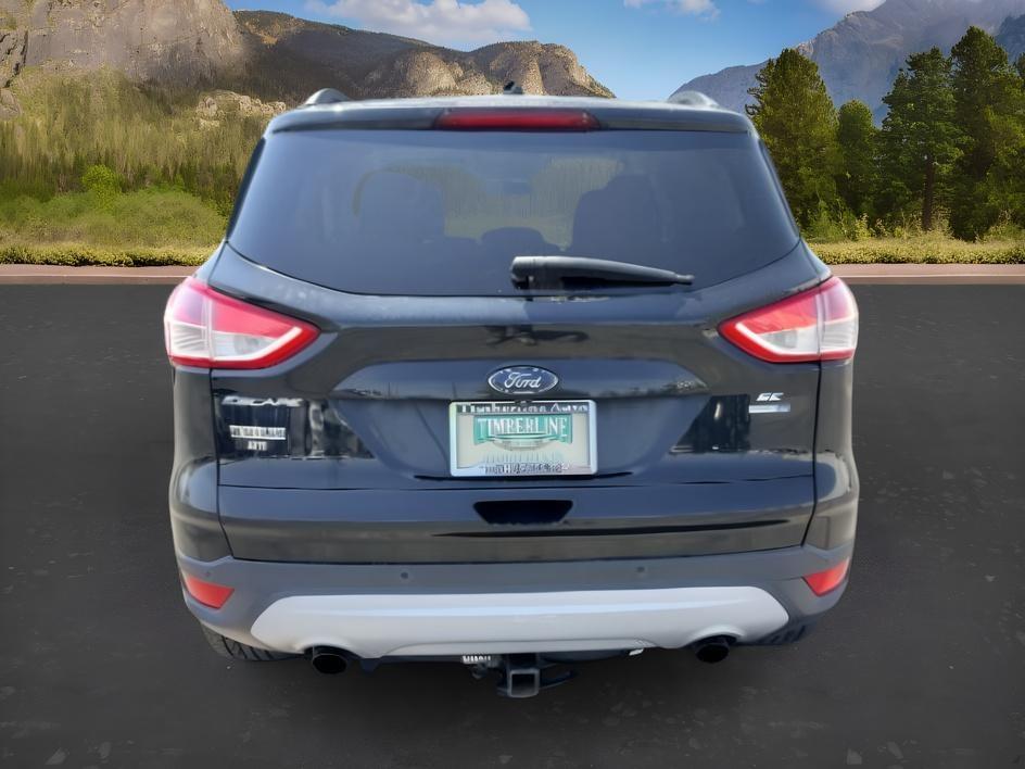2014 BLACK /CLOTH Ford Escape (1FMCU9GX2EU) with an 16L I4 engine, Automatic transmission, located at 1175 N Woodruff Ave, Idaho Falls, ID, 83401, 43.506901, -111.999657 - Compact SUV practicality and everyday drivability come together in this 2014 Ford Escape 4WD equipped with a 1.6L EcoBoost turbocharged engine. Four wheel drive capability adds traction for changing road conditions while the compact SUV size keeps it easy to maneuver around town and in tighter parki- Photo#3