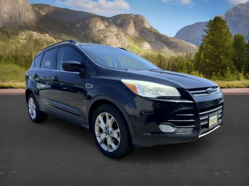 2014 BLACK /CLOTH Ford Escape (1FMCU9GX2EU) with an 16L I4 engine, Automatic transmission, located at 1175 N Woodruff Ave, Idaho Falls, ID, 83401, 43.506901, -111.999657 - Compact SUV practicality and everyday drivability come together in this 2014 Ford Escape 4WD equipped with a 1.6L EcoBoost turbocharged engine. Four wheel drive capability adds traction for changing road conditions while the compact SUV size keeps it easy to maneuver around town and in tighter parki- Photo#9