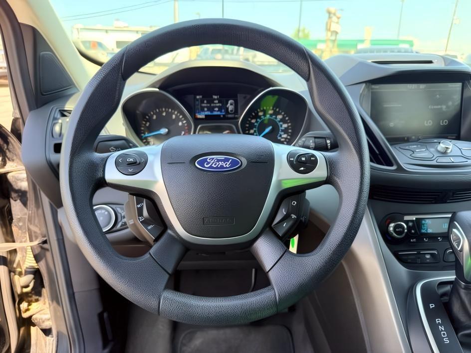 2014 BLACK /CLOTH Ford Escape (1FMCU9GX2EU) with an 16L I4 engine, Automatic transmission, located at 1175 N Woodruff Ave, Idaho Falls, ID, 83401, 43.506901, -111.999657 - Compact SUV practicality and everyday drivability come together in this 2014 Ford Escape 4WD equipped with a 1.6L EcoBoost turbocharged engine. Four wheel drive capability adds traction for changing road conditions while the compact SUV size keeps it easy to maneuver around town and in tighter parki- Photo#16