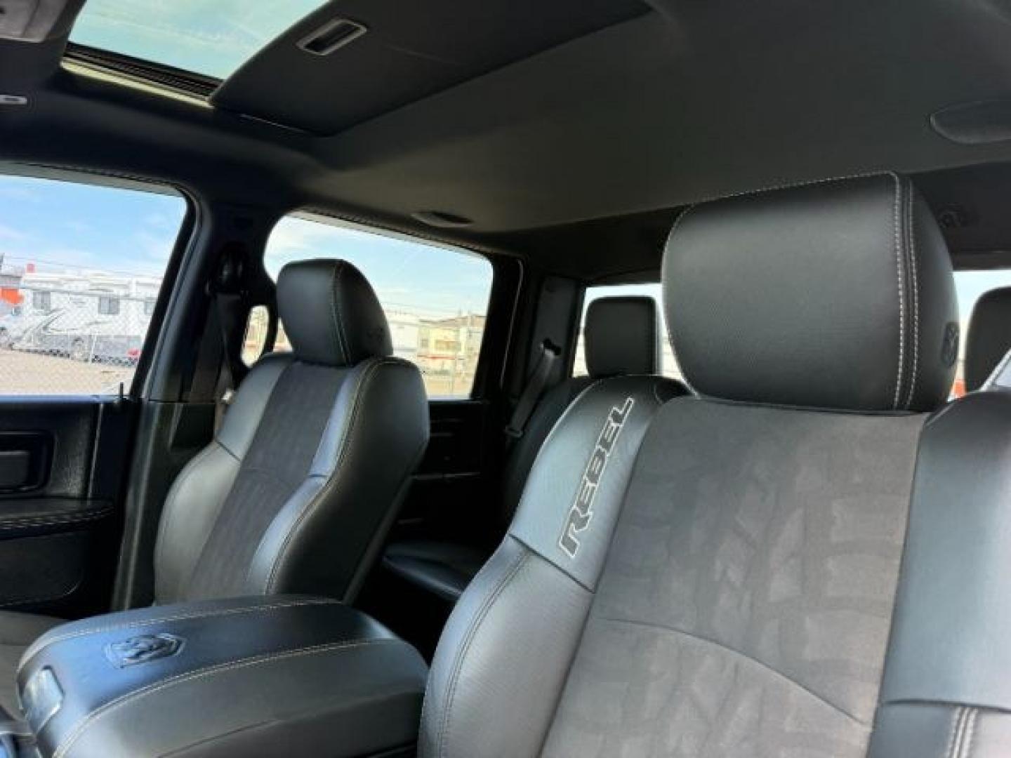 2017 Bright White Clearcoat /Red/Black Ram 1500 Rebel Crew Cab 4x4 5'7 Box (1C6RR7YT3HS) with an HEMI 5.7L V-8 variable valve control engine, AUTOMATIC transmission, located at 1235 N Woodruff Ave., Idaho Falls, 83401, (208) 523-1053, 43.507172, -112.000488 - At Timberline Auto, finding a great deal on your next vehicle is always easy! Our experienced sales staff goal is to help find you the right vehicle at the right price! Our knowledgeable finance department has options for almost any credit score. We offer extended service contract options to prot - Photo#51