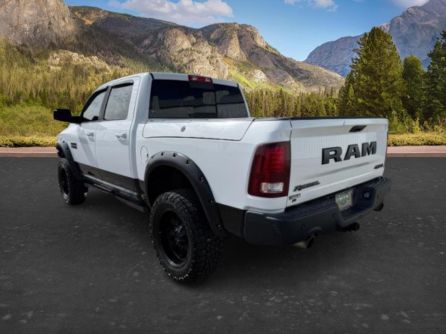 2017 Bright White Clearcoat /Red/Black Ram 1500 Rebel Crew Cab 4x4 5'7 Box (1C6RR7YT3HS) with an HEMI 5.7L V-8 variable valve control engine, AUTOMATIC transmission, located at 1235 N Woodruff Ave., Idaho Falls, 83401, (208) 523-1053, 43.507172, -112.000488 - At Timberline Auto, finding a great deal on your next vehicle is always easy! Our experienced sales staff goal is to help find you the right vehicle at the right price! Our knowledgeable finance department has options for almost any credit score. We offer extended service contract options to prot - Photo#2
