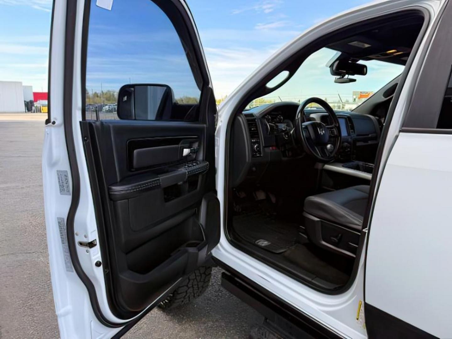 2017 Bright White Clearcoat /Red/Black Ram 1500 Rebel Crew Cab 4x4 5'7 Box (1C6RR7YT3HS) with an HEMI 5.7L V-8 variable valve control engine, AUTOMATIC transmission, located at 1235 N Woodruff Ave., Idaho Falls, 83401, (208) 523-1053, 43.507172, -112.000488 - At Timberline Auto, finding a great deal on your next vehicle is always easy! Our experienced sales staff goal is to help find you the right vehicle at the right price! Our knowledgeable finance department has options for almost any credit score. We offer extended service contract options to prot - Photo#12
