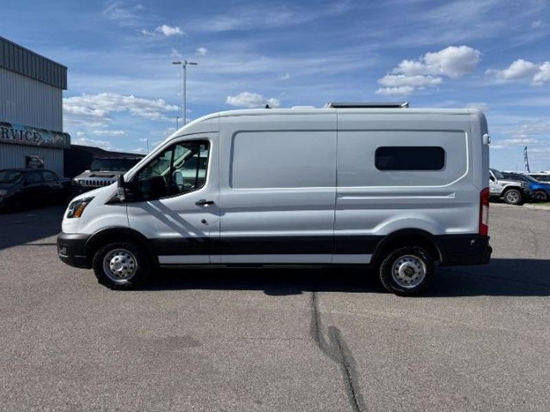 2021 Oxford White /Ebony Ford Transit Van Base (1FTBR2CG7MK) with an V6, 3.5L engine, 10-speed automatic transmission, located at 1175 N Woodruff Ave, Idaho Falls, ID, 83401, 43.506901, -111.999657 - <b>Vehicle Details</b><br>This 2021 Ford Transit Van EL T-250 Med Roof Slide Base is a versatile and capable full-size van designed to handle demanding commercial and passenger transport needs with confidence. With only 32,484 miles, it offers plenty of life left for business use, fleet expansion, o- Photo#1