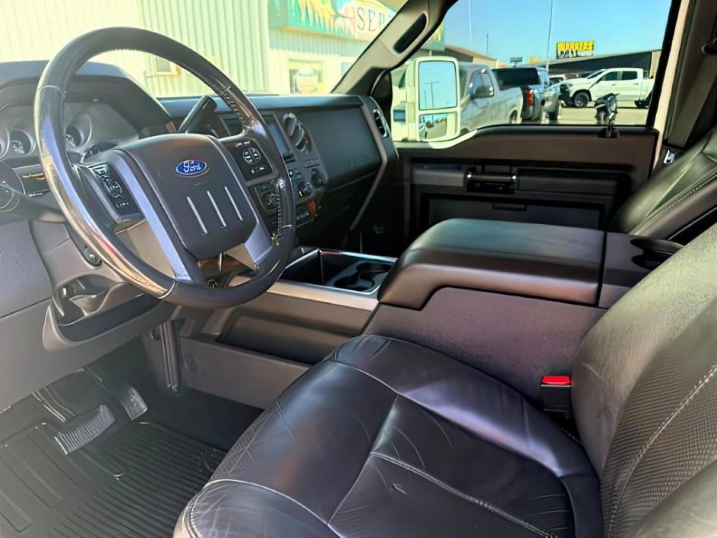 2011 WHITE /LEATHER Ford Super Duty F-350 SRW (1FT8W3BT2BE) with an 67L engine, Automatic transmission, located at 1175 N Woodruff Ave, Idaho Falls, ID, 83401, 43.506901, -111.999657 - At Timberline Auto, finding a great deal on your next vehicle is always easy! Our experienced sales staff goal is to help find you the right vehicle at the right price! Our knowledgeable finance department has options for almost any credit score. We offer extended service contract options to prot- Photo#12