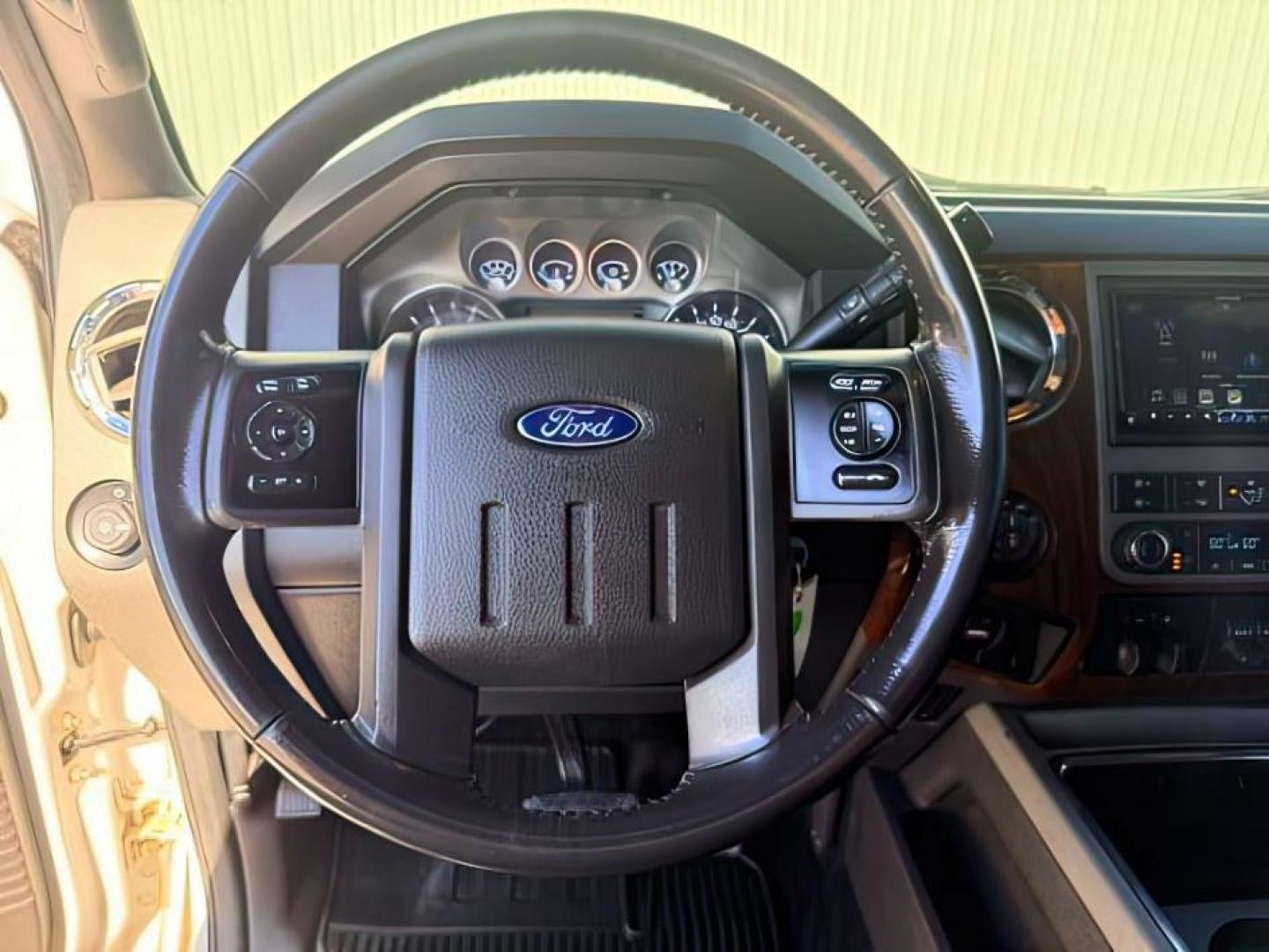 2011 WHITE /LEATHER Ford Super Duty F-350 SRW (1FT8W3BT2BE) with an 67L engine, Automatic transmission, located at 1175 N Woodruff Ave, Idaho Falls, ID, 83401, 43.506901, -111.999657 - At Timberline Auto, finding a great deal on your next vehicle is always easy! Our experienced sales staff goal is to help find you the right vehicle at the right price! Our knowledgeable finance department has options for almost any credit score. We offer extended service contract options to prot- Photo#13