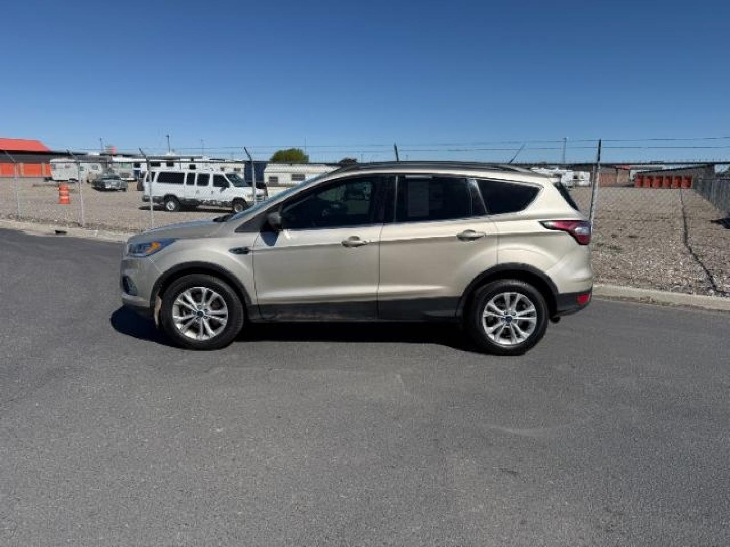 2018 GOLD /Medium Light Stone Ford Escape (1FMCU9HD3JU) with an EcoBoost 15L I-4 gasoline direct injection engine, Automatic transmission, located at 1175 N Woodruff Ave, Idaho Falls, ID, 83401, 43.506901, -111.999657 - At Timberline Auto, finding a great deal on your next vehicle is always easy! Our experienced sales staff goal is to help find you the right vehicle at the right price! Our knowledgeable finance department has options for almost any credit score. We offer extended service contract options to prot - Photo#1
