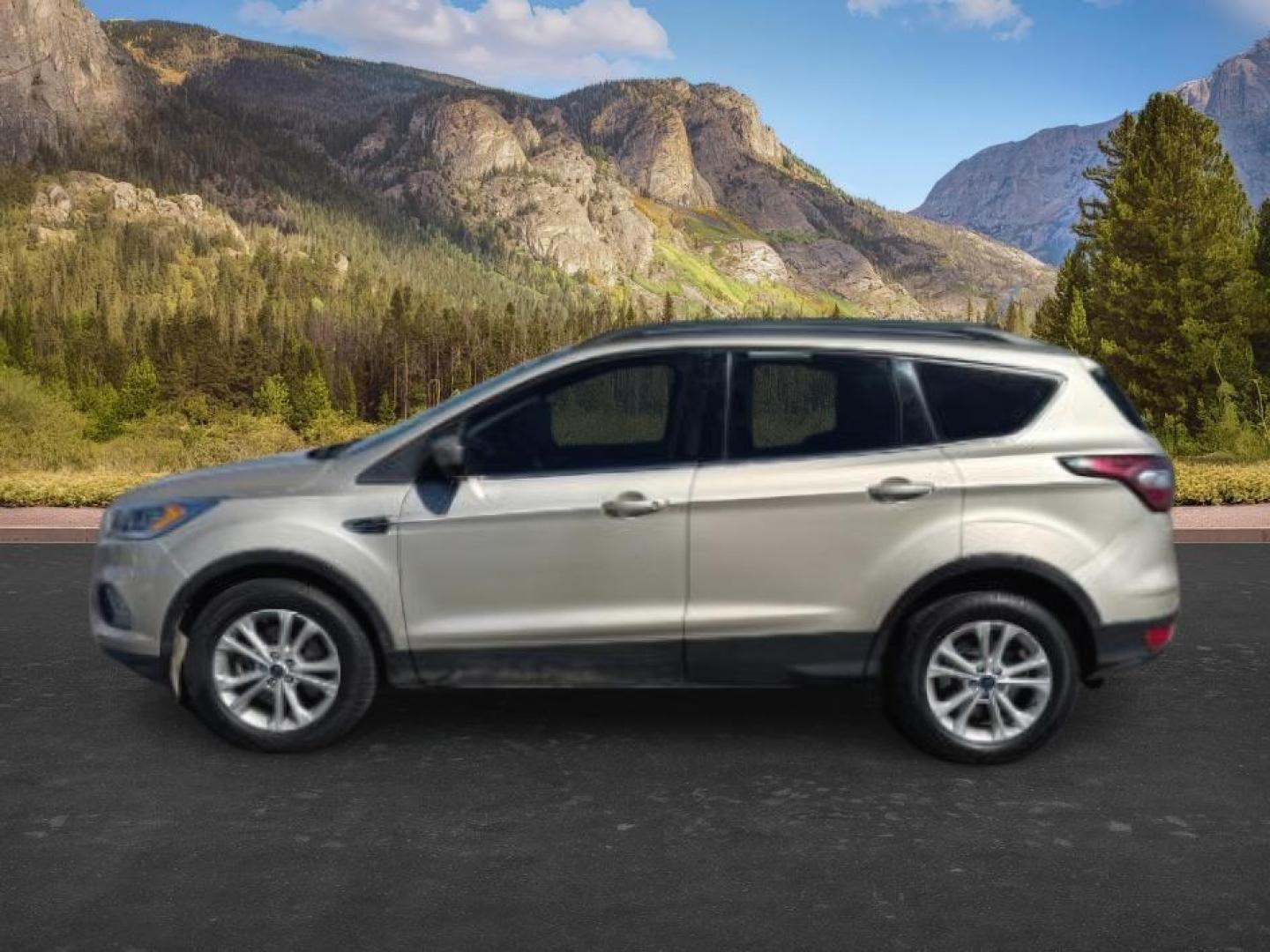 2018 GOLD /Medium Light Stone Ford Escape (1FMCU9HD3JU) with an EcoBoost 15L I-4 gasoline direct injection engine, Automatic transmission, located at 1175 N Woodruff Ave, Idaho Falls, ID, 83401, 43.506901, -111.999657 - At Timberline Auto, finding a great deal on your next vehicle is always easy! Our experienced sales staff goal is to help find you the right vehicle at the right price! Our knowledgeable finance department has options for almost any credit score. We offer extended service contract options to prot - Photo#0