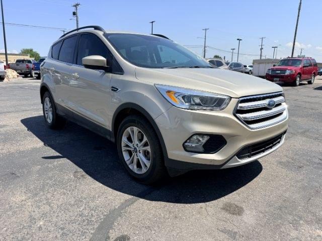 2018 GOLD /Medium Light Stone Ford Escape (1FMCU9HD3JU) with an EcoBoost 15L I-4 gasoline direct injection engine, Automatic transmission, located at 1175 N Woodruff Ave, Idaho Falls, ID, 83401, 43.506901, -111.999657- Photo#34