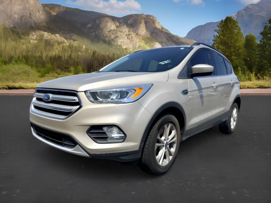 2018 GOLD /Medium Light Stone Ford Escape (1FMCU9HD3JU) with an EcoBoost 15L I-4 gasoline direct injection engine, Automatic transmission, located at 1175 N Woodruff Ave, Idaho Falls, ID, 83401, 43.506901, -111.999657- Photo#0