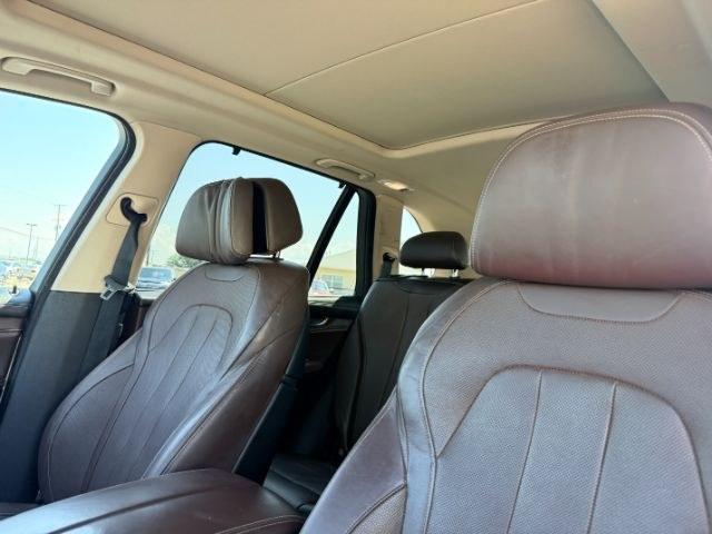 2014 SILVER /Black BMW X5 xDrive35i (5UXKR0C57E0) with an 3L I-6 gasoline direct injection engine, AUTOMATIC transmission, located at 1235 N Woodruff Ave., Idaho Falls, 83401, (208) 523-1053, 43.507172, -112.000488 - This 2014 BMW X5 delivers a smooth turbocharged inline-6 paired with BMW's xDrive AWD system for confident everyday driving and highway comfort. The cabin offers a premium feel with seating for five and flexible cargo space for daily use, travel, or errands. It balances luxury and practicality in a- Photo#50
