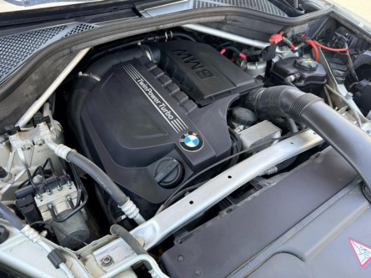 2014 SILVER /Black BMW X5 xDrive35i (5UXKR0C57E0) with an 6 Cyl, 3.0L engine, 8-speed automatic transmission, located at 1175 N Woodruff Ave, Idaho Falls, ID, 83401, 43.506901, -111.999657 - <b>Vehicle Details</b><br>Experience refined performance and premium comfort in this 2014 BMW X5 xDrive35i, now available in Idaho Falls, ID. This luxury SUV pairs BMW's intelligent AWD system with a responsive 6-cylinder, 3.0L gasoline engine, delivering confident acceleration and composed handling- Photo#83