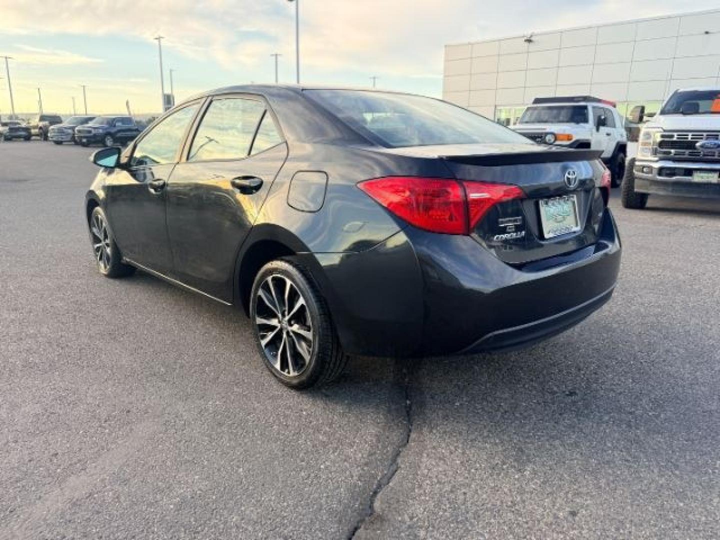 2018 BLACK /Black Toyota Corolla (2T1BURHE4JC) with an 18L I-4 DOHC engine, Automatic transmission, located at 1175 N Woodruff Ave, Idaho Falls, ID, 83401, 43.506901, -111.999657 - Efficiency and everyday reliability define this 2018 Toyota Corolla SE, powered by a 1.8L 4 cylinder engine paired with a CVT transmission and front wheel drive layout. This configuration delivers smooth, predictable driving characteristics that make it a strong fit for commuting, daily errands, and- Photo#2