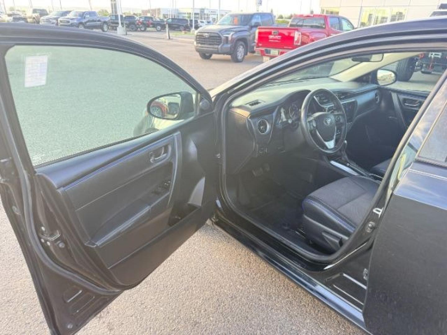 2018 BLACK /Black Toyota Corolla (2T1BURHE4JC) with an 18L I-4 DOHC engine, Automatic transmission, located at 1175 N Woodruff Ave, Idaho Falls, ID, 83401, 43.506901, -111.999657 - Efficiency and everyday reliability define this 2018 Toyota Corolla SE, powered by a 1.8L 4 cylinder engine paired with a CVT transmission and front wheel drive layout. This configuration delivers smooth, predictable driving characteristics that make it a strong fit for commuting, daily errands, and- Photo#11