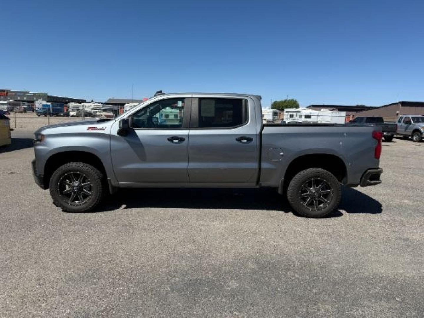 2021 GRAY /Jet Black Chevrolet Silverado 1500 4WD Crew Cab Short Bed LT Trail Boss (3GCPYFED6MG) with an EcoTec3 6.2L V-8 gasoline direct injection engine, AUTOMATIC transmission, located at 1235 N Woodruff Ave., Idaho Falls, 83401, (208) 523-1053, 43.507172, -112.000488 - At Timberline Auto, finding a great deal on your next vehicle is always easy! Our experienced sales staff goal is to help find you the right vehicle at the right price! Our knowledgeable finance department has options for almost any credit score. We offer extended service contract options to prot - Photo#1