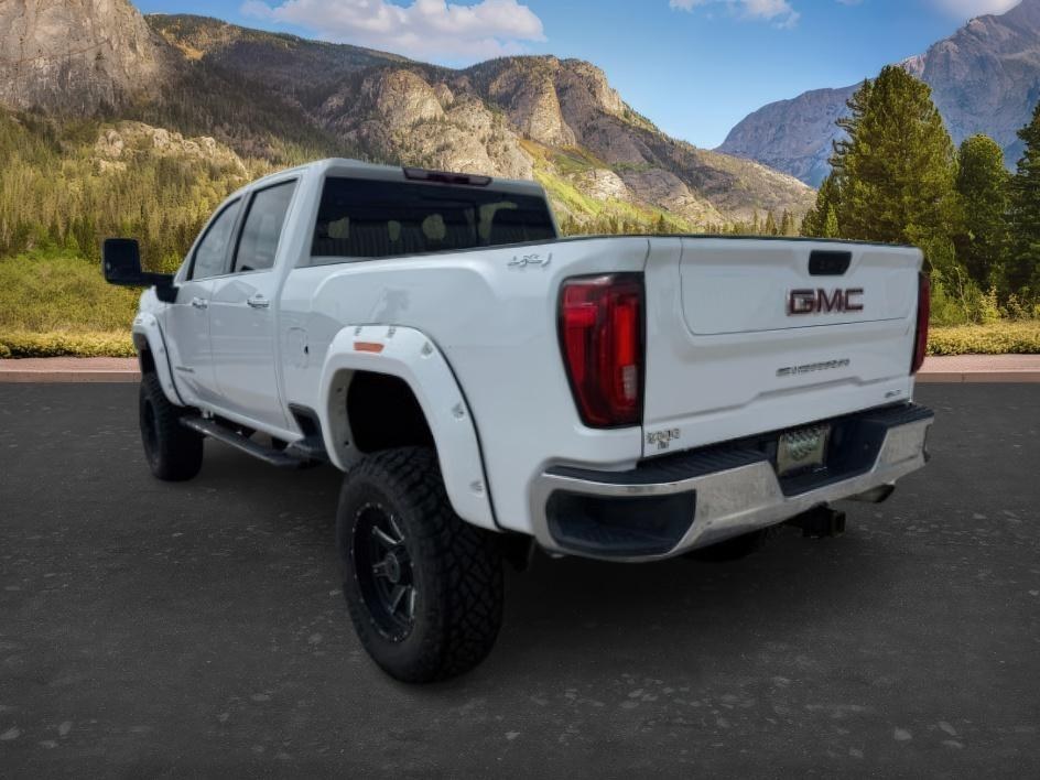 2022 WHITE /Jet Black GMC Sierra 2500HD SLT Crew Cab 4WD (1GT49NE77NF) with an 6.6L V8 OHV 16V engine, 6-Speed Automatic transmission, located at 1235 N Woodruff Ave., Idaho Falls, 83401, (208) 523-1053, 43.507172, -112.000488 - At Timberline Auto, finding a great deal on your next vehicle is always easy! Our experienced sales staff goal is to help find you the right vehicle at the right price! Our knowledgeable finance department has options for almost any credit score. We offer extended service contract options to prot - Photo#2