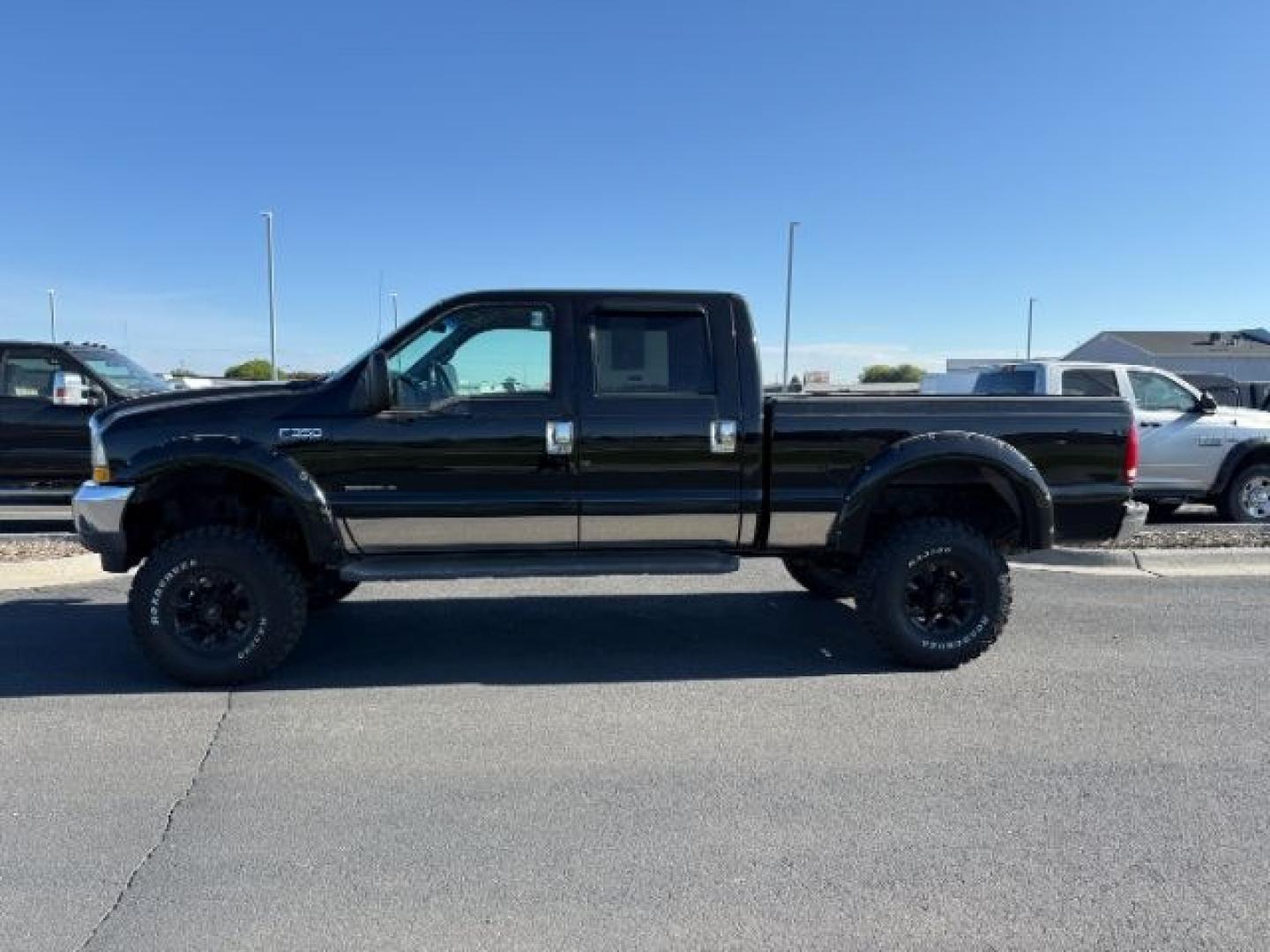 2002 BLACK /Medium Flint Ford F-350 (1FTSW31F32E) with an Powerstroke 73L V-8 diesel direct injection engine, Automatic transmission, located at 1175 N Woodruff Ave, Idaho Falls, ID, 83401, 43.506901, -111.999657 - At Timberline Auto, finding a great deal on your next vehicle is always easy! Our experienced sales staff goal is to help find you the right vehicle at the right price! Our knowledgeable finance department has options for almost any credit score. We offer extended service contract options to prot - Photo#1