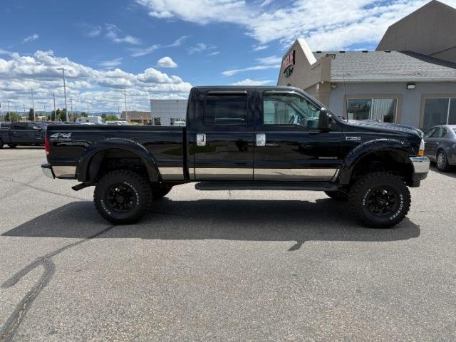 2002 BLACK /Medium Flint Ford F-350 LARIAT (1FTSW31F32E) with an Powerstroke 7.3L V-8 diesel direct injection engine, AUTOMATIC transmission, located at 1235 N Woodruff Ave., Idaho Falls, 83401, (208) 523-1053, 43.507172, -112.000488 - At Timberline Auto, finding a great deal on your next vehicle is always easy! Our experienced sales staff goal is to help find you the right vehicle at the right price! Our knowledgeable finance department has options for almost any credit score. We offer extended service contract options to prot - Photo#30