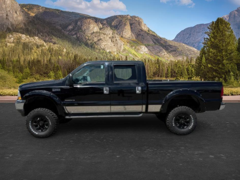 2002 BLACK /Medium Flint Ford F-350 LARIAT (1FTSW31F32E) with an Powerstroke 7.3L V-8 diesel direct injection engine, AUTOMATIC transmission, located at 1235 N Woodruff Ave., Idaho Falls, 83401, (208) 523-1053, 43.507172, -112.000488 - At Timberline Auto, finding a great deal on your next vehicle is always easy! Our experienced sales staff goal is to help find you the right vehicle at the right price! Our knowledgeable finance department has options for almost any credit score. We offer extended service contract options to prot - Photo#1