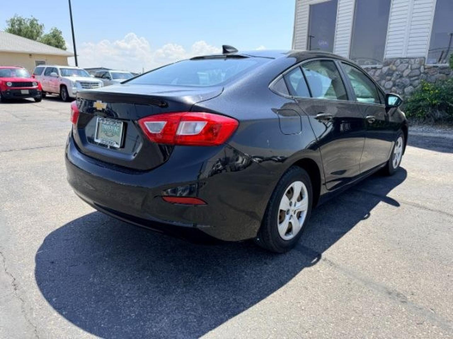 2016 BLACK /Jet Black Chevrolet Cruze (1G1BC5SM4G7) with an 14L I-4 gasoline direct injection engine, Automatic transmission, located at 1175 N Woodruff Ave, Idaho Falls, ID, 83401, 43.506901, -111.999657 - Efficient performance and everyday comfort come together in this 2016 Chevrolet Cruze. Powered by a responsive 1.4L turbocharged 4-cylinder engine and front-wheel drive, it offers an enjoyable driving experience while helping keep fuel costs down. The four-door sedan layout provides comfortable seat- Photo#26