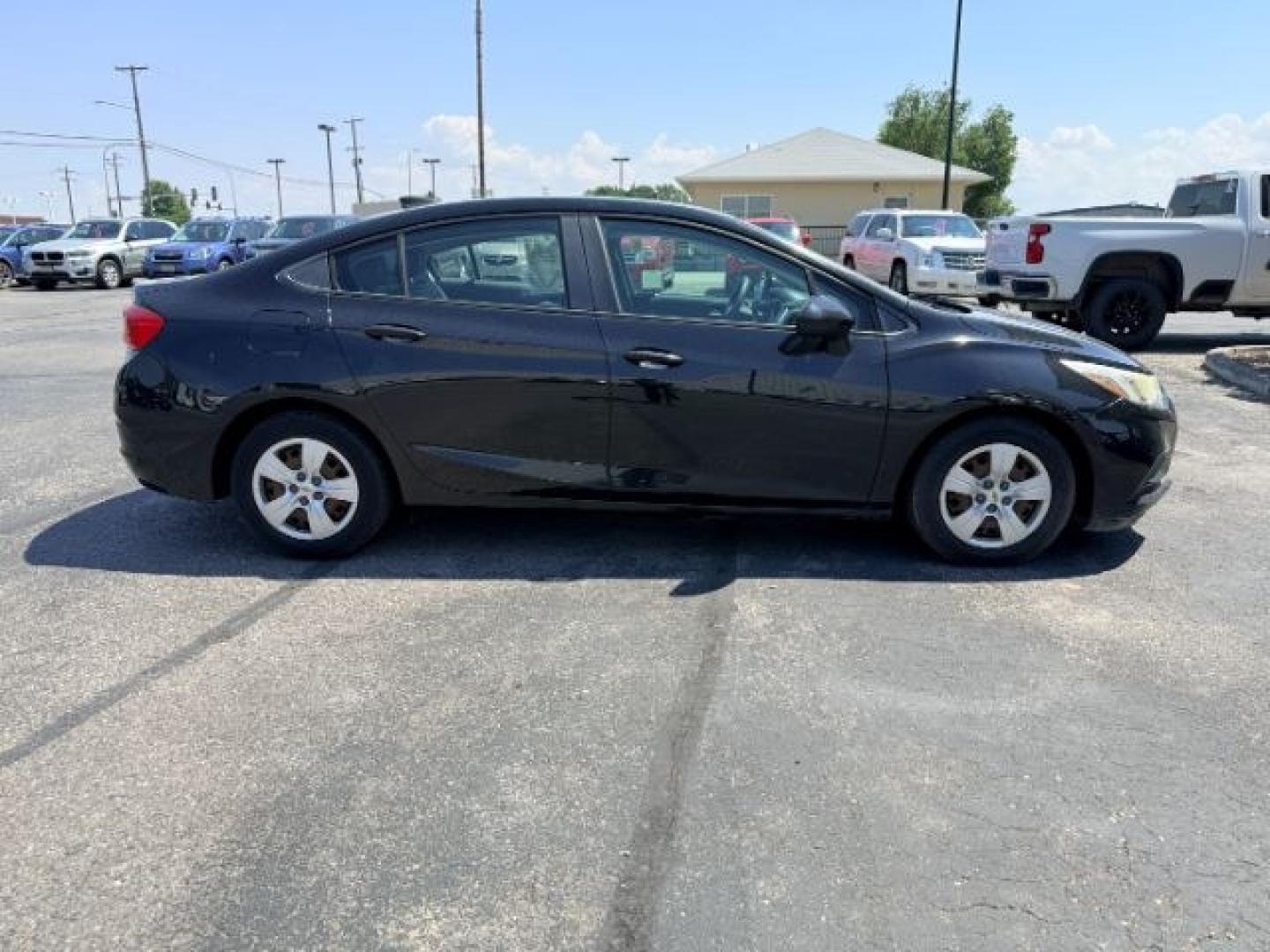 2016 BLACK /Jet Black Chevrolet Cruze (1G1BC5SM4G7) with an 14L I-4 gasoline direct injection engine, Automatic transmission, located at 1175 N Woodruff Ave, Idaho Falls, ID, 83401, 43.506901, -111.999657 - Efficient performance and everyday comfort come together in this 2016 Chevrolet Cruze. Powered by a responsive 1.4L turbocharged 4-cylinder engine and front-wheel drive, it offers an enjoyable driving experience while helping keep fuel costs down. The four-door sedan layout provides comfortable seat- Photo#27