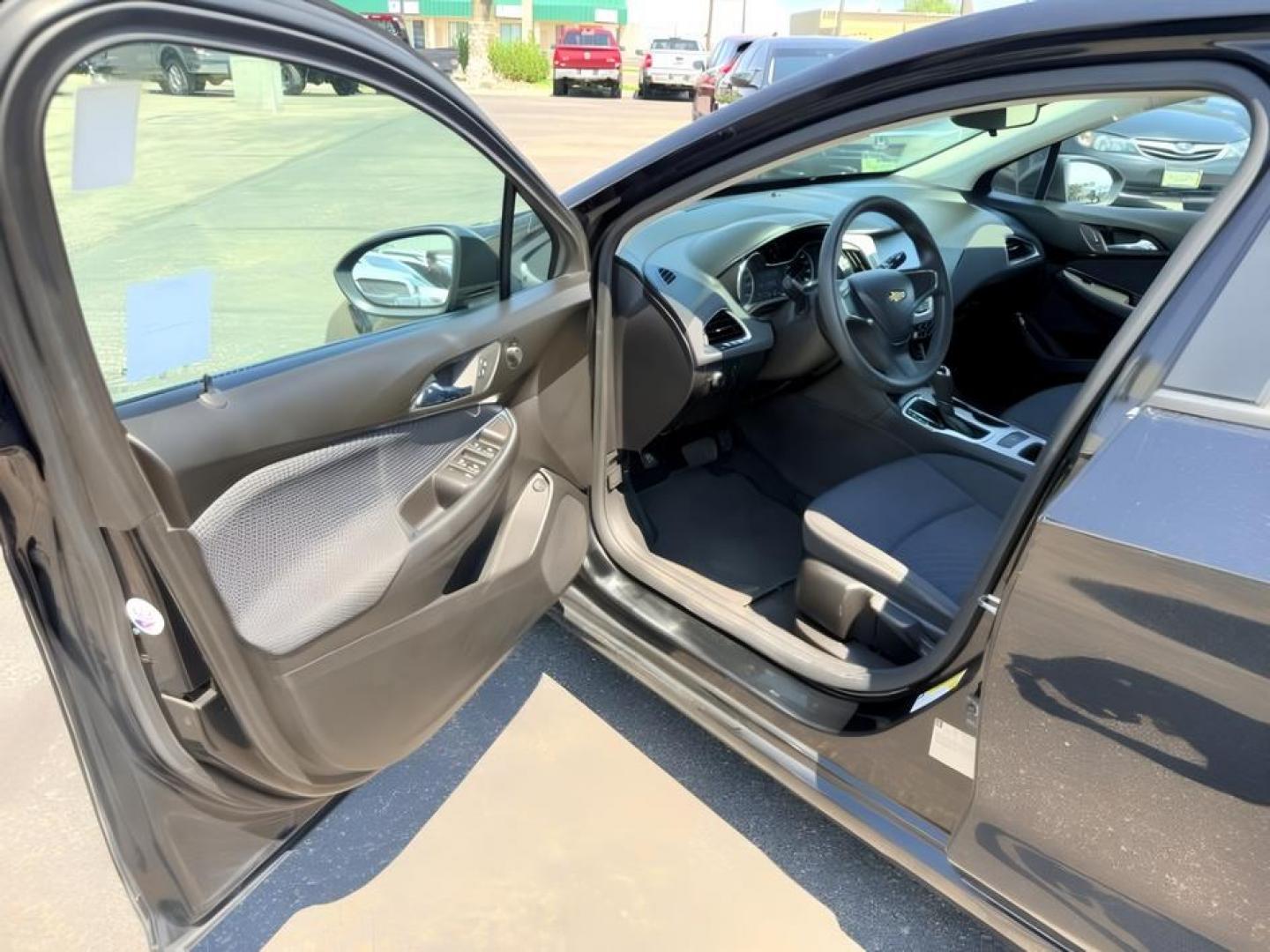 2016 BLACK /Jet Black Chevrolet Cruze (1G1BC5SM4G7) with an 14L I-4 gasoline direct injection engine, Automatic transmission, located at 1175 N Woodruff Ave, Idaho Falls, ID, 83401, 43.506901, -111.999657 - Efficient performance and everyday comfort come together in this 2016 Chevrolet Cruze. Powered by a responsive 1.4L turbocharged 4-cylinder engine and front-wheel drive, it offers an enjoyable driving experience while helping keep fuel costs down. The four-door sedan layout provides comfortable seat- Photo#10