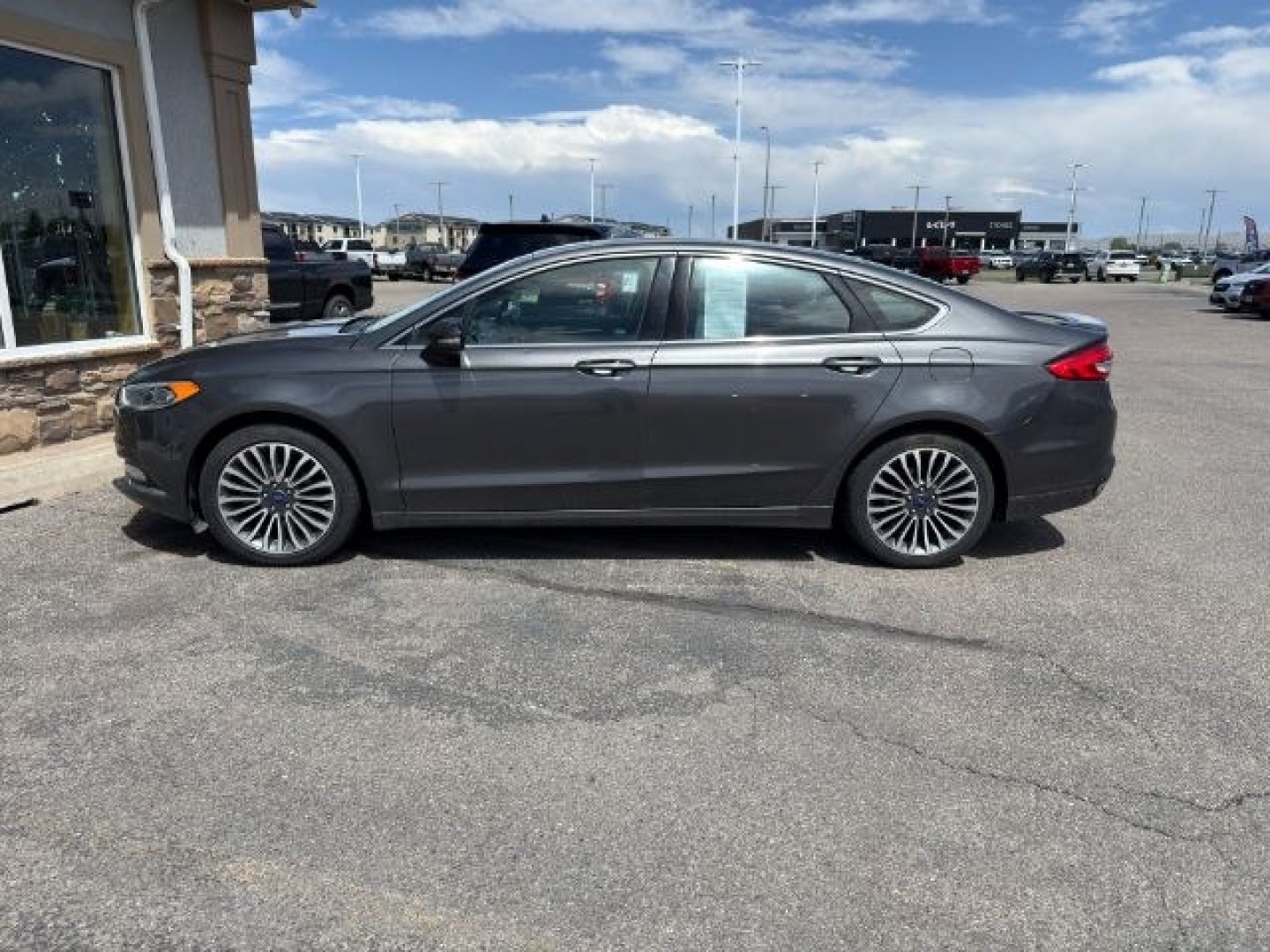 2017 GRAY /Ebony Ford Fusion (3FA6P0K90HR) with an EcoBoost 2L I-4 gasoline direct injection engine, Automatic transmission, located at 1175 N Woodruff Ave, Idaho Falls, ID, 83401, 43.506901, -111.999657 - At Timberline Auto, finding a great deal on your next vehicle is always easy! Our experienced sales staff goal is to help find you the right vehicle at the right price! Our knowledgeable finance department has options for almost any credit score. We offer extended service contract options to prot - Photo#1