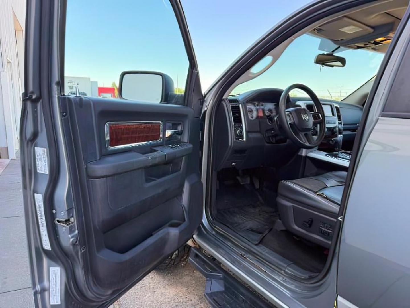 2009 GRAY /Dark Slate Dodge Ram 1500 (1D3HV13T79S) with an HEMI 57L V-8 variable valve control engine, Automatic transmission, located at 1175 N Woodruff Ave, Idaho Falls, ID, 83401, 43.506901, -111.999657 - At Timberline Auto, finding a great deal on your next vehicle is always easy! Our experienced sales staff goal is to help find you the right vehicle at the right price! Our knowledgeable finance department has options for almost any credit score. We offer extended service contract options to prot - Photo#9