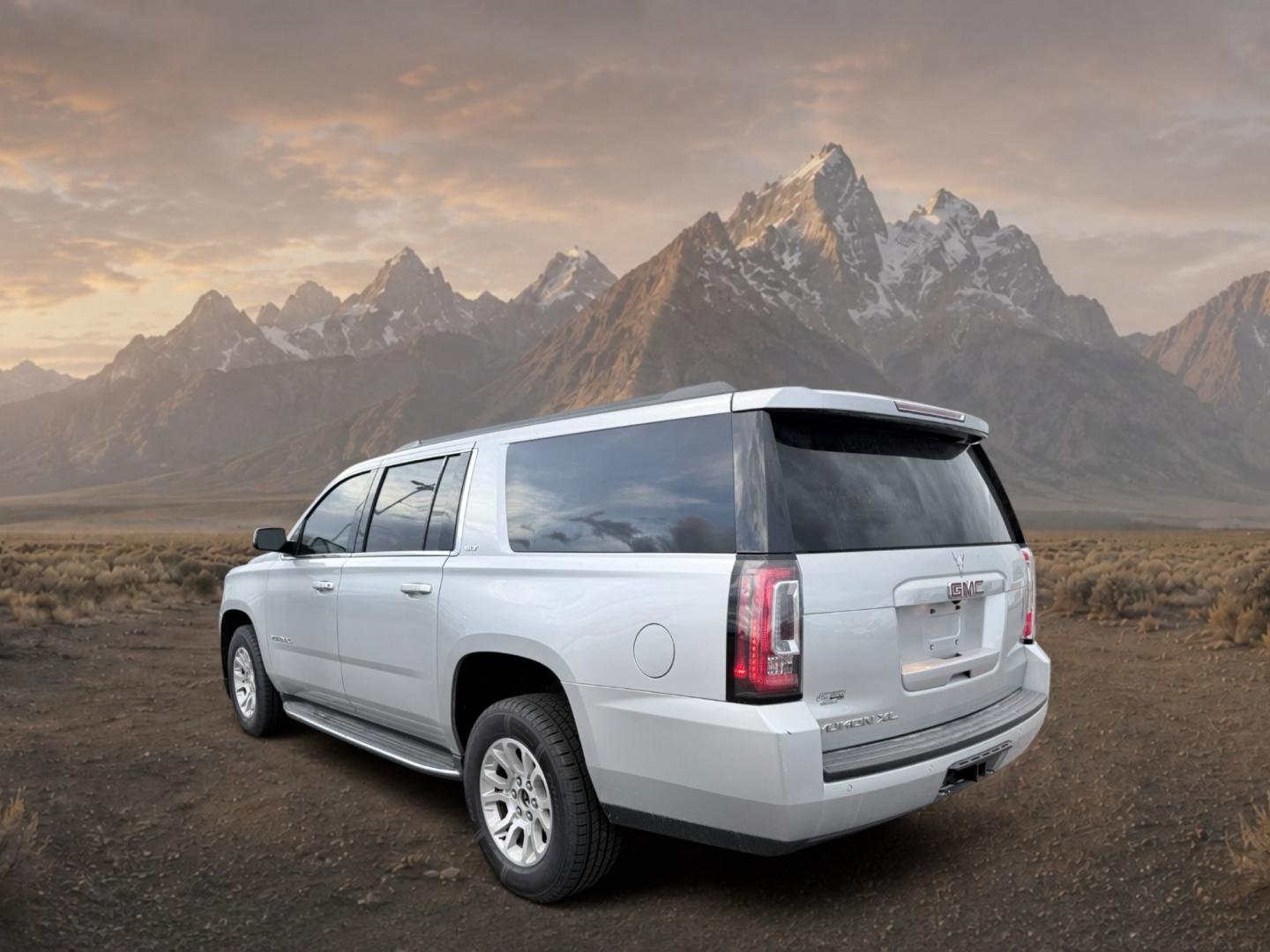 2017 Quicksilver Metallic /Jet Black GMC Yukon XL SLT (1GKS2GKC5HR) with an V8, 5.3L engine, 6-speed automatic transmission, located at 1175 N Woodruff Ave, Idaho Falls, ID, 83401, 43.506901, -111.999657 - <b>Vehicle Details</b><br>This 2017 GMC Yukon XL 1500 SLT 4WD is a spacious, well-appointed full-size SUV designed to deliver comfort, capability, and confidence in one refined package. Powered by a proven V8, 5.3L gasoline engine, it offers strong performance for daily driving, towing, and long roa- Photo#2