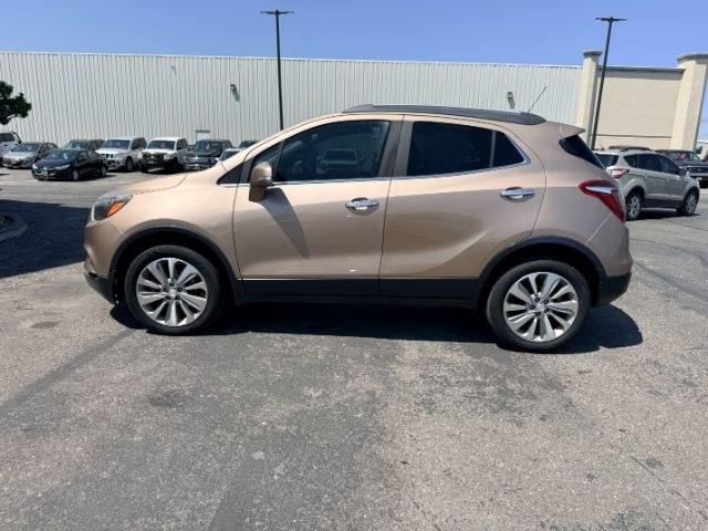 2018 GOLD /Ebony Buick Encore (KL4CJESB7JB) with an ECOTEC 14L I-4 DOHC engine, Automatic transmission, located at 1175 N Woodruff Ave, Idaho Falls, ID, 83401, 43.506901, -111.999657 - At Timberline Auto, finding a great deal on your next vehicle is always easy! Our experienced sales staff goal is to help find you the right vehicle at the right price! Our knowledgeable finance department has options for almost any credit score. We offer extended service contract options to prot- Photo#28