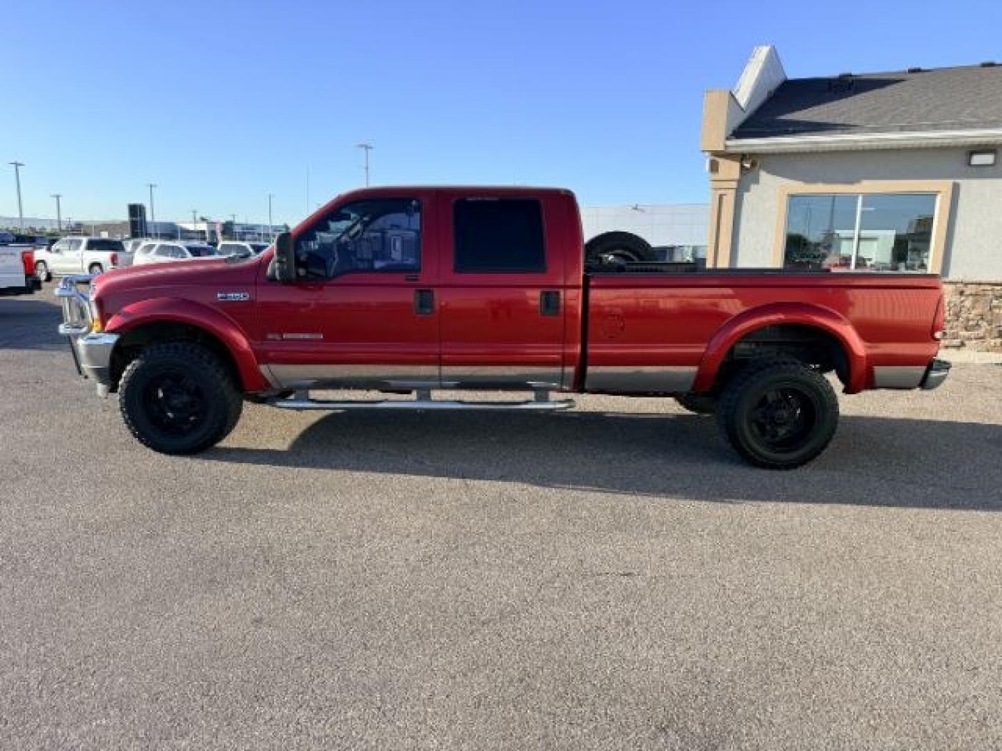 2002 RED /Medium Flint Ford F-350 (1FTSW31F92E) with an Powerstroke 73L V-8 diesel direct injection engine, Automatic transmission, located at 1175 N Woodruff Ave, Idaho Falls, ID, 83401, 43.506901, -111.999657 - At Timberline Auto, finding a great deal on your next vehicle is always easy! Our experienced sales staff goal is to help find you the right vehicle at the right price! Our knowledgeable finance department has options for almost any credit score. We offer extended service contract options to prot- Photo#26