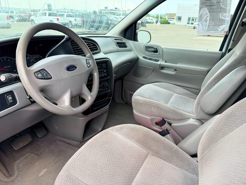 2001 SILVER /Medium Graphite Ford Windstar (2FMZA51451B) with an 38L V-6 regular unleaded engine, Automatic transmission, located at 1175 N Woodruff Ave, Idaho Falls, ID, 83401, 43.506901, -111.999657 - At Timberline Auto, finding a great deal on your next vehicle is always easy! Our experienced sales staff goal is to help find you the right vehicle at the right price! Our knowledgeable finance department has options for almost any credit score. We offer extended service contract options to prot- Photo#14