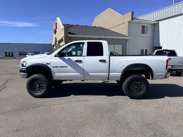 2006 WHITE /Medium Slate Gray Cloth Interior Dodge Ram 2500 ST Quad Cab 4WD (1D7KS28D56J) with an 5.7L V8 OHV 16V engine, 4-Speed Automatic transmission, located at 1235 N Woodruff Ave., Idaho Falls, 83401, (208) 523-1053, 43.507172, -112.000488 - At Timberline Auto, finding a great deal on your next vehicle is always easy! Our experienced sales staff goal is to help find you the right vehicle at the right price! Our knowledgeable finance department has options for almost any credit score. We offer extended service contract options to prot- Photo#1