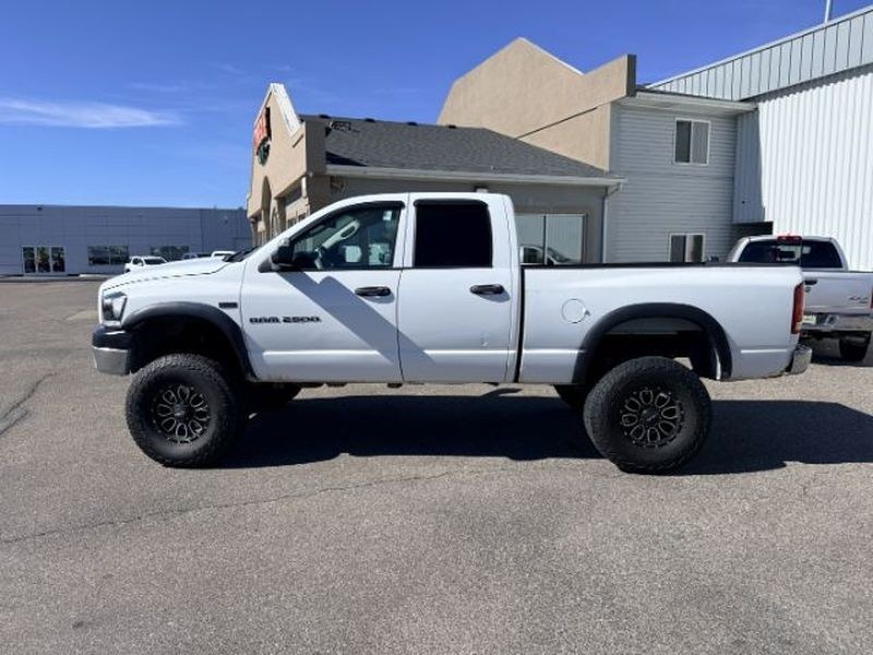 2006 WHITE /Medium Slate Gray Dodge Ram Pickup ST (1D7KS28D56J) with an V8, 5.7L engine, 6-speed manual transmission, located at 1175 N Woodruff Ave, Idaho Falls, ID, 83401, 43.506901, -111.999657 - <b>Vehicle Details</b><br>Get ready to tackle tough jobs and weekend adventures in this **2006 Dodge Ram Pickup 2500 ST Quad Cab 4WD**. Built with legendary Dodge strength and powered by a **V8 5.7L Gasoline engine**, this heavy-duty pickup delivers the capability, confidence, and rugged style drive- Photo#1