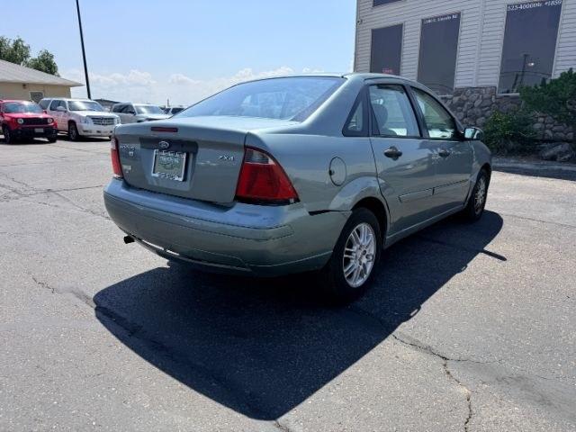 2005 GREEN /CLOTH Ford Focus (1FAFP34N35W) with an 20L I4 engine, Automatic transmission, located at 1175 N Woodruff Ave, Idaho Falls, ID, 83401, 43.506901, -111.999657 - At Timberline Auto, finding a great deal on your next vehicle is always easy! Our experienced sales staff goal is to help find you the right vehicle at the right price! Our knowledgeable finance department has options for almost any credit score. We offer extended service contract options to prot- Photo#20