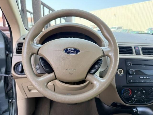 2005 GREEN /CLOTH Ford Focus (1FAFP34N35W) with an 20L I4 engine, Automatic transmission, located at 1175 N Woodruff Ave, Idaho Falls, ID, 83401, 43.506901, -111.999657 - At Timberline Auto, finding a great deal on your next vehicle is always easy! Our experienced sales staff goal is to help find you the right vehicle at the right price! Our knowledgeable finance department has options for almost any credit score. We offer extended service contract options to prot- Photo#26