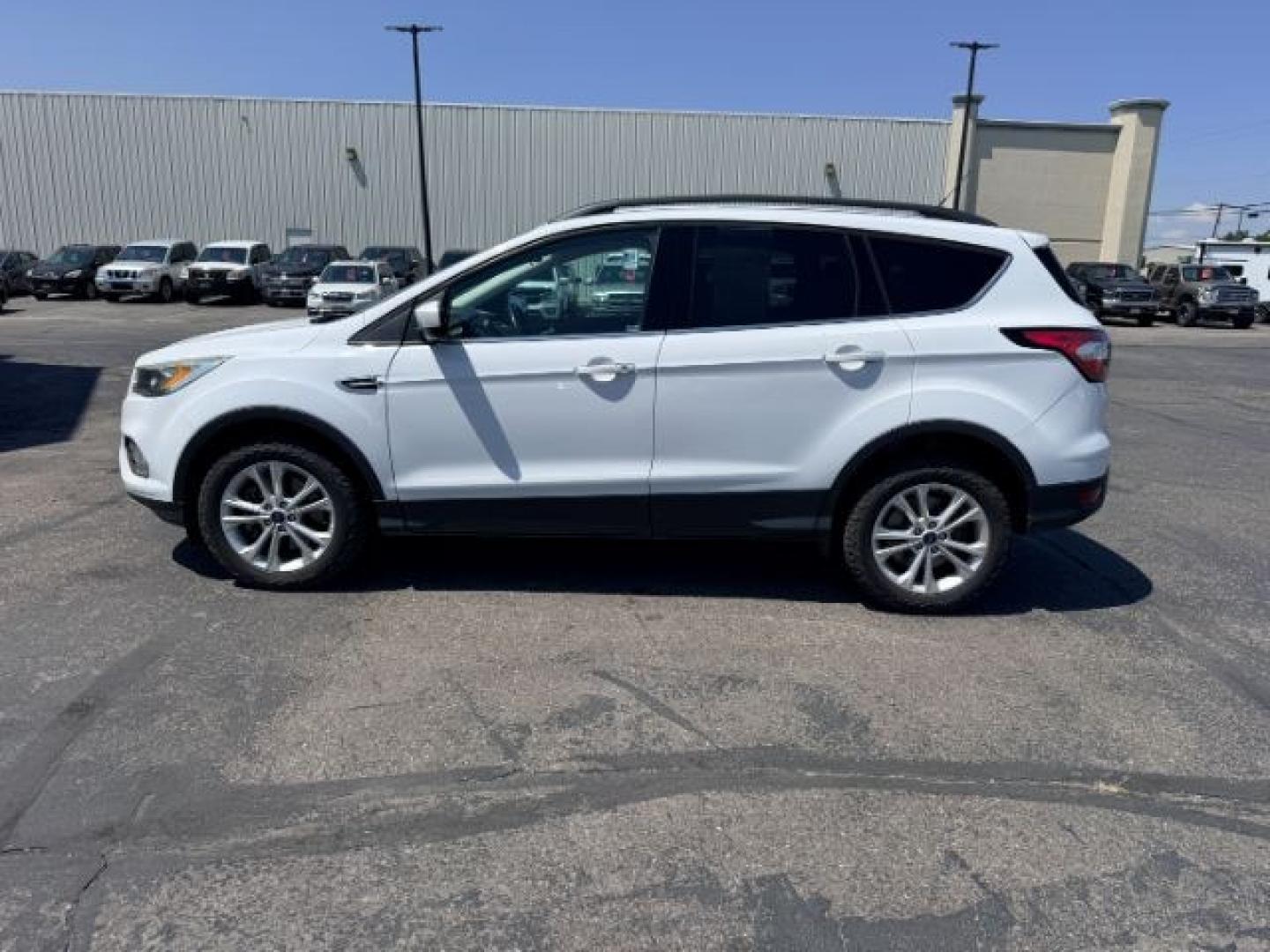 2018 WHITE /Medium Light Stone Ford Escape (1FMCU9HD1JU) with an EcoBoost 15L I-4 gasoline direct injection engine, Automatic transmission, located at 1175 N Woodruff Ave, Idaho Falls, ID, 83401, 43.506901, -111.999657 - At Timberline Auto, finding a great deal on your next vehicle is always easy! Our experienced sales staff goal is to help find you the right vehicle at the right price! Our knowledgeable finance department has options for almost any credit score. We offer extended service contract options to prot- Photo#29