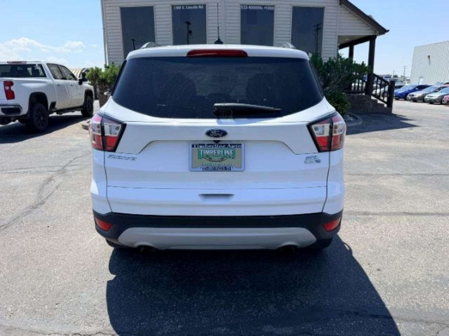 2018 WHITE /Medium Light Stone Ford Escape (1FMCU9HD1JU) with an EcoBoost 15L I-4 gasoline direct injection engine, Automatic transmission, located at 1175 N Woodruff Ave, Idaho Falls, ID, 83401, 43.506901, -111.999657 - At Timberline Auto, finding a great deal on your next vehicle is always easy! Our experienced sales staff goal is to help find you the right vehicle at the right price! Our knowledgeable finance department has options for almost any credit score. We offer extended service contract options to prot- Photo#31