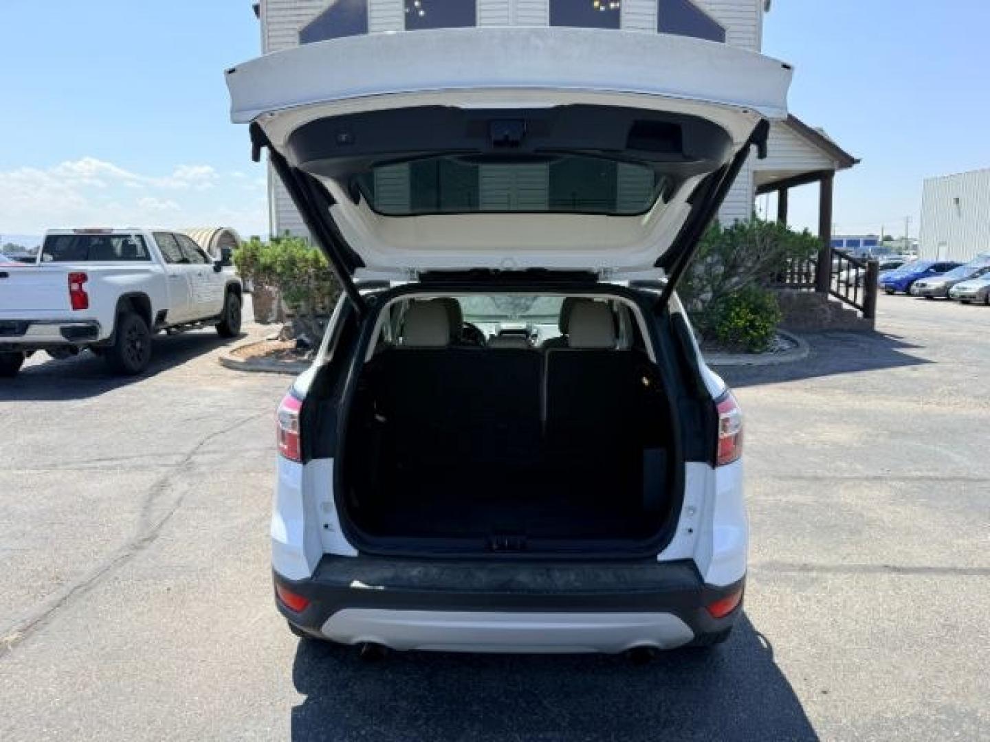 2018 WHITE /Medium Light Stone Ford Escape (1FMCU9HD1JU) with an EcoBoost 15L I-4 gasoline direct injection engine, Automatic transmission, located at 1175 N Woodruff Ave, Idaho Falls, ID, 83401, 43.506901, -111.999657 - At Timberline Auto, finding a great deal on your next vehicle is always easy! Our experienced sales staff goal is to help find you the right vehicle at the right price! Our knowledgeable finance department has options for almost any credit score. We offer extended service contract options to prot- Photo#33