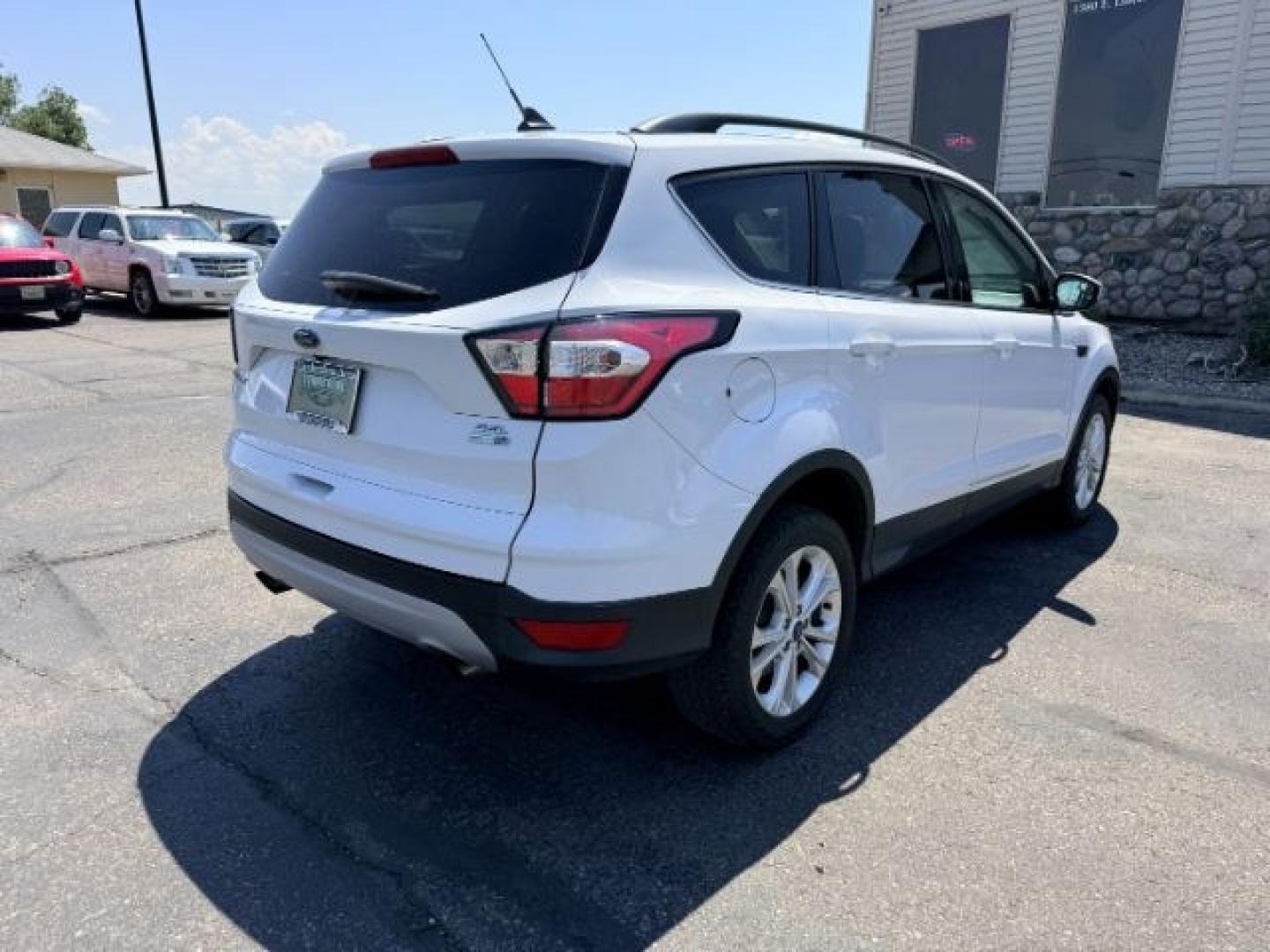 2018 WHITE /Medium Light Stone Ford Escape (1FMCU9HD1JU) with an EcoBoost 15L I-4 gasoline direct injection engine, Automatic transmission, located at 1175 N Woodruff Ave, Idaho Falls, ID, 83401, 43.506901, -111.999657 - At Timberline Auto, finding a great deal on your next vehicle is always easy! Our experienced sales staff goal is to help find you the right vehicle at the right price! Our knowledgeable finance department has options for almost any credit score. We offer extended service contract options to prot- Photo#36