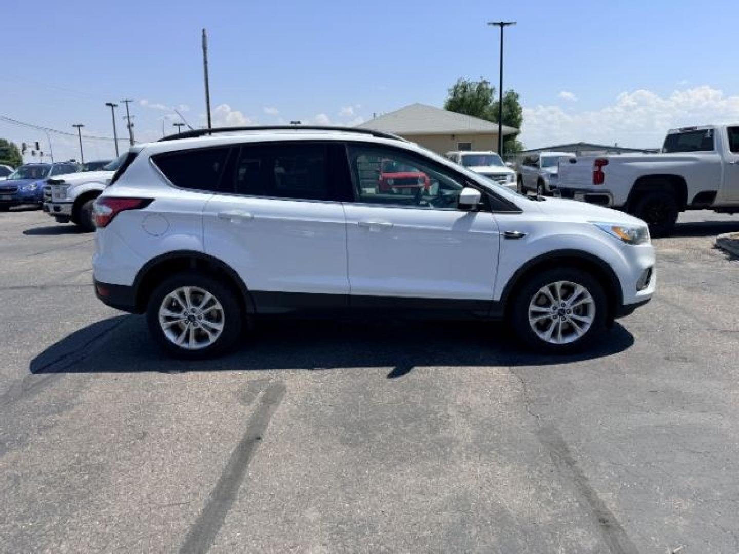 2018 WHITE /Medium Light Stone Ford Escape (1FMCU9HD1JU) with an EcoBoost 15L I-4 gasoline direct injection engine, Automatic transmission, located at 1175 N Woodruff Ave, Idaho Falls, ID, 83401, 43.506901, -111.999657 - At Timberline Auto, finding a great deal on your next vehicle is always easy! Our experienced sales staff goal is to help find you the right vehicle at the right price! Our knowledgeable finance department has options for almost any credit score. We offer extended service contract options to prot- Photo#37