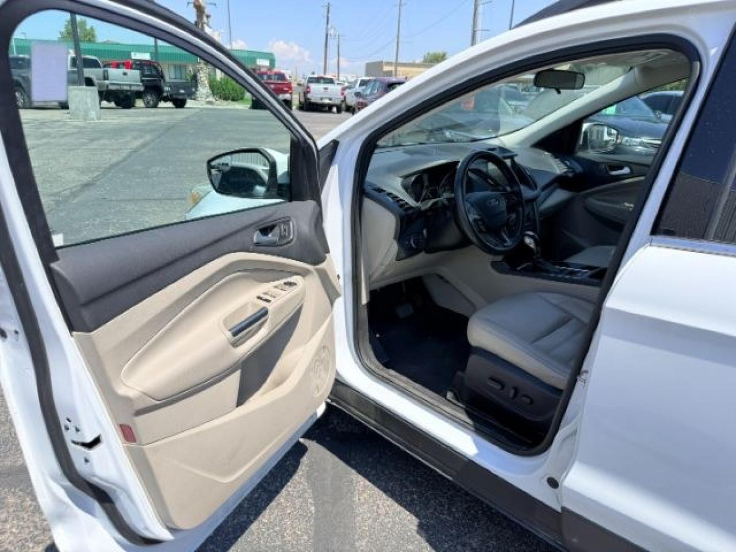2018 WHITE /Medium Light Stone Ford Escape (1FMCU9HD1JU) with an EcoBoost 15L I-4 gasoline direct injection engine, Automatic transmission, located at 1175 N Woodruff Ave, Idaho Falls, ID, 83401, 43.506901, -111.999657 - At Timberline Auto, finding a great deal on your next vehicle is always easy! Our experienced sales staff goal is to help find you the right vehicle at the right price! Our knowledgeable finance department has options for almost any credit score. We offer extended service contract options to prot- Photo#42