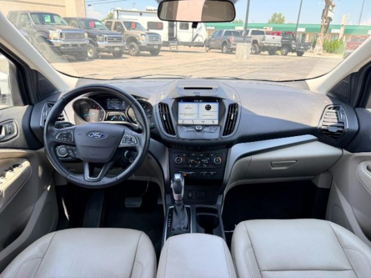 2018 WHITE /Medium Light Stone Ford Escape (1FMCU9HD1JU) with an EcoBoost 15L I-4 gasoline direct injection engine, Automatic transmission, located at 1175 N Woodruff Ave, Idaho Falls, ID, 83401, 43.506901, -111.999657 - At Timberline Auto, finding a great deal on your next vehicle is always easy! Our experienced sales staff goal is to help find you the right vehicle at the right price! Our knowledgeable finance department has options for almost any credit score. We offer extended service contract options to prot- Photo#53